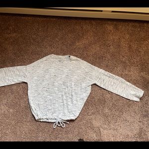 Fuzzy soft grey tie bottom sweater